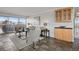 Comfortable living room with balcony access, stylish seating, and seamless flow into the kitchen area at 909 N Logan St # 11A, Denver, CO 80203