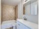 Clean bathroom, featuring a shower/tub combo and white vanity at 1289 Newark St, Aurora, CO 80010