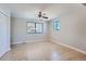 Spacious bedroom with tile flooring and a ceiling fan at 1289 Newark St, Aurora, CO 80010