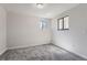 Cozy bedroom, featuring grey carpet and a window at 1289 Newark St, Aurora, CO 80010