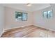 Well-lit bedroom, featuring hardwood floors and a large window at 1289 Newark St, Aurora, CO 80010