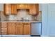 Kitchen with wood cabinets and sink at 1289 Newark St, Aurora, CO 80010