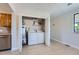 Convenient laundry room with washer, dryer, and water heater at 1289 Newark St, Aurora, CO 80010