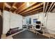 Unfinished basement area with workout equipment, a desk area and a window at 9624 Dunning Cir, Highlands Ranch, CO 80126