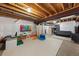 Unfinished basement with a designated play area and space for recreational activities at 9624 Dunning Cir, Highlands Ranch, CO 80126