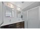 Modern bathroom featuring double sinks, sleek vanity and glass-enclosed shower at 9624 Dunning Cir, Highlands Ranch, CO 80126