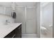 Bright bathroom showcasing a sleek vanity, modern fixtures, and a glass-enclosed shower at 9624 Dunning Cir, Highlands Ranch, CO 80126