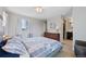 Comfortable bedroom with queen bed, dresser, and en-suite bathroom at 9624 Dunning Cir, Highlands Ranch, CO 80126