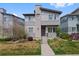 Charming two-story home with modern design, landscaped front yard, and concrete entry steps at 9624 Dunning Cir, Highlands Ranch, CO 80126