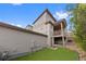 Back exterior of home featuring a balcony and a small fenced in yard at 9624 Dunning Cir, Highlands Ranch, CO 80126