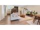 Bright living room featuring wood floors, modern furnishings, large windows, and decorative shelving at 9624 Dunning Cir, Highlands Ranch, CO 80126