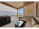 Relaxing outdoor patio space with wicker furniture, ambient lighting, and an outdoor grill at 9624 Dunning Cir, Highlands Ranch, CO 80126
