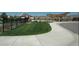 A walkway to a shared community pool and park at 9624 Dunning Cir, Highlands Ranch, CO 80126