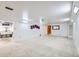Basement area featuring painted walls, carpet, and several installed light fixtures at 2070 Kingston St, Aurora, CO 80010