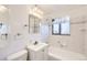 Bathroom featuring white tile, vanity with sink, medicine cabinet, and combination shower and tub at 2070 Kingston St, Aurora, CO 80010