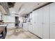 Spacious laundry room featuring a washer, dryer and plenty of storage cabinets at 2070 Kingston St, Aurora, CO 80010