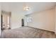 Neutral bedroom with carpet floors, and an open closet showing ample space at 679 S Pearl St, Elizabeth, CO 80107