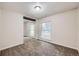Bedroom featuring carpeted floors, neutral walls, a sliding door closet, and window at 679 S Pearl St, Elizabeth, CO 80107