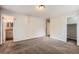 Bedroom with carpet floors, adjoining bathroom, and an open closet at 679 S Pearl St, Elizabeth, CO 80107