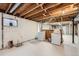 Basement laundry area with washer and dryer hookups, offering convenience and functionality in the home at 679 S Pearl St, Elizabeth, CO 80107
