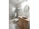 Clean bathroom with a shower-tub combination, modern vanity, and white tile at 17530 E Caspian Pl, Aurora, CO 80013