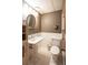 Bathroom with a pedestal sink, wainscotting, and traditional fixtures at 17530 E Caspian Pl, Aurora, CO 80013