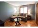 Comfortable bedroom with a pullout couch and natural light from a window at 17530 E Caspian Pl, Aurora, CO 80013