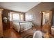 Bedroom featuring hardwood floors, a window seat, and neutral-colored walls at 17530 E Caspian Pl, Aurora, CO 80013