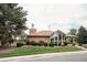 Community clubhouse with brick exterior and manicured landscaping, offering an inviting recreational space at 17530 E Caspian Pl, Aurora, CO 80013