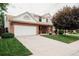 Beautiful two-story home with brick facade, large driveway, and well-maintained landscaping at 17530 E Caspian Pl, Aurora, CO 80013