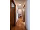 Bright hallway features hardwood floors and traditional wood trim with access to various rooms at 17530 E Caspian Pl, Aurora, CO 80013