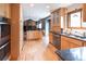 Spacious kitchen with stainless steel appliances and breakfast bar overlooking living space at 17530 E Caspian Pl, Aurora, CO 80013