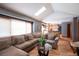 Open-concept living room with views into kitchen and ample natural light at 17530 E Caspian Pl, Aurora, CO 80013