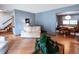 Open concept living space showing hardwood floors and seamless flow to dining area at 17530 E Caspian Pl, Aurora, CO 80013