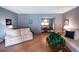 Comfortable living area with hardwood floors, neutral walls, and easy access to dining area at 17530 E Caspian Pl, Aurora, CO 80013