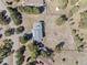Aerial view of a home with surrounding trees and a spacious lot at 2999 Olympia Cir, Evergreen, CO 80439