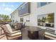Spacious back deck with a fire pit and ample seating, perfect for relaxing outdoors at 2999 Olympia Cir, Evergreen, CO 80439