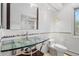 Modern bathroom with unique glass bowl sink and decorative tile accents at 2999 Olympia Cir, Evergreen, CO 80439