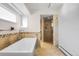 Modern bathroom with a standalone tub and walk-in shower at 2999 Olympia Cir, Evergreen, CO 80439
