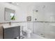 Stylish bathroom with a glass-enclosed shower and a modern vanity sink at 2999 Olympia Cir, Evergreen, CO 80439