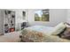 Bedroom featuring a view of the trees, a desk, and a full bookshelf at 2999 Olympia Cir, Evergreen, CO 80439