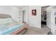 Bright bedroom with closet, art, and view of the hallway at 2999 Olympia Cir, Evergreen, CO 80439