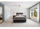 Cozy bedroom with a large window offering a view of the surrounding landscape at 2999 Olympia Cir, Evergreen, CO 80439