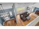 Second floor aerial view of the living room and entrance at 2999 Olympia Cir, Evergreen, CO 80439