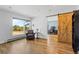 Cozy living room with a barn door to an office at 2999 Olympia Cir, Evergreen, CO 80439