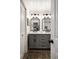 Modern bathroom features double vanities, stylish fixtures, and decorative mirrors for a sophisticated look at 12941 W 75Th Ave, Arvada, CO 80005
