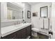A stylish bathroom featuring a modern vanity, subway tile, and updated fixtures at 12941 W 75Th Ave, Arvada, CO 80005