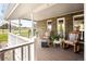 Welcoming front porch featuring rocking chairs, stylish decor and a lovely view at 12941 W 75Th Ave, Arvada, CO 80005