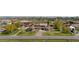 Expansive front yard featuring a circular driveway, lush lawn, and mature trees at 12941 W 75Th Ave, Arvada, CO 80005