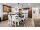 Well-equipped kitchen with a large island, bar seating, and wood cabinets at 12941 W 75Th Ave, Arvada, CO 80005